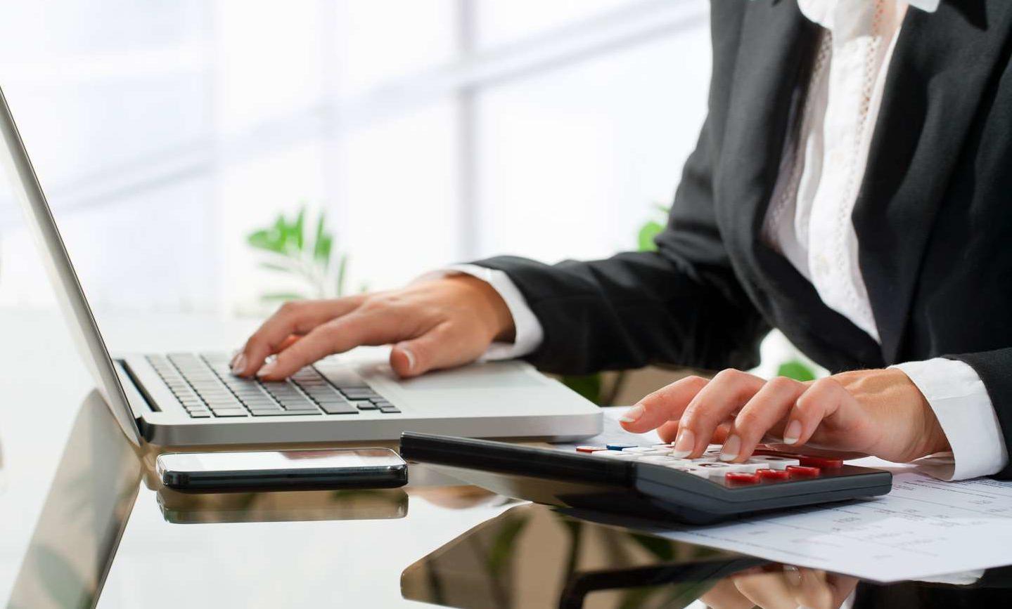 woman with calculator and keyboard